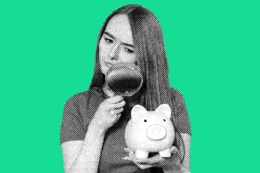 Lady with piggy bank and magnifying glass