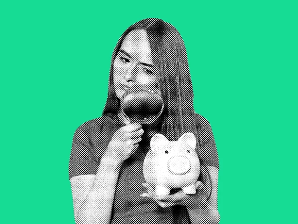 Lady with piggy bank and magnifying glass